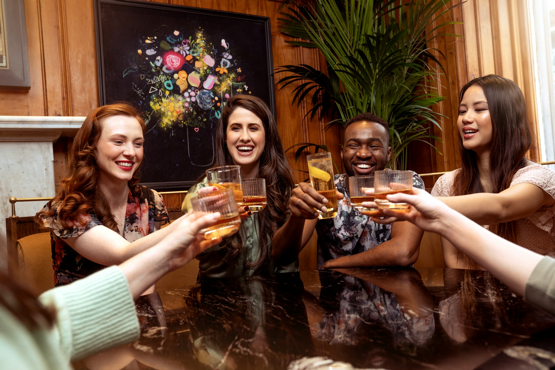 Friends toasting drinks at restaurant